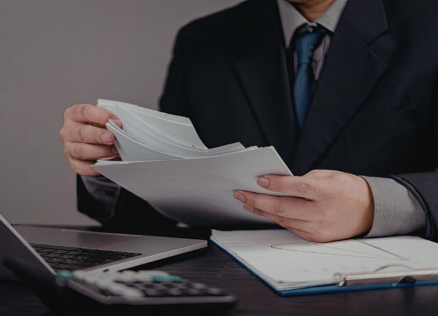 PRO officer organizing government paperwork for Dubai clients