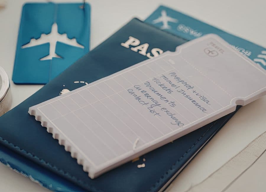 Dubai travel planning with passport, tickets and hotel reservation details