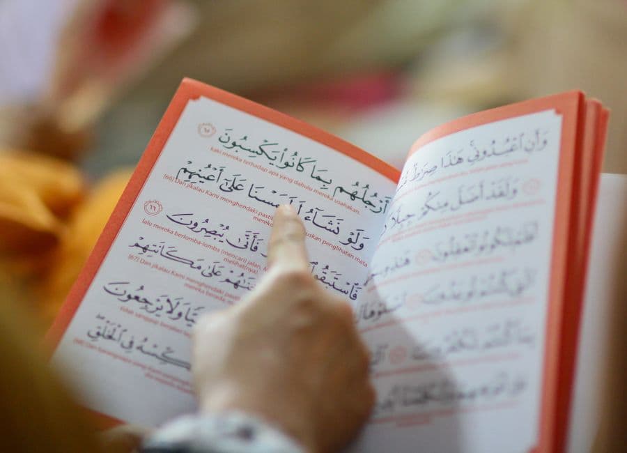 Certified translator reviewing Arabic and English legal documents