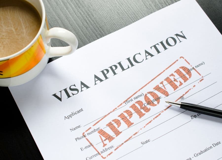 Consultant reviewing UAE visa and residency documents at a Dubai office desk